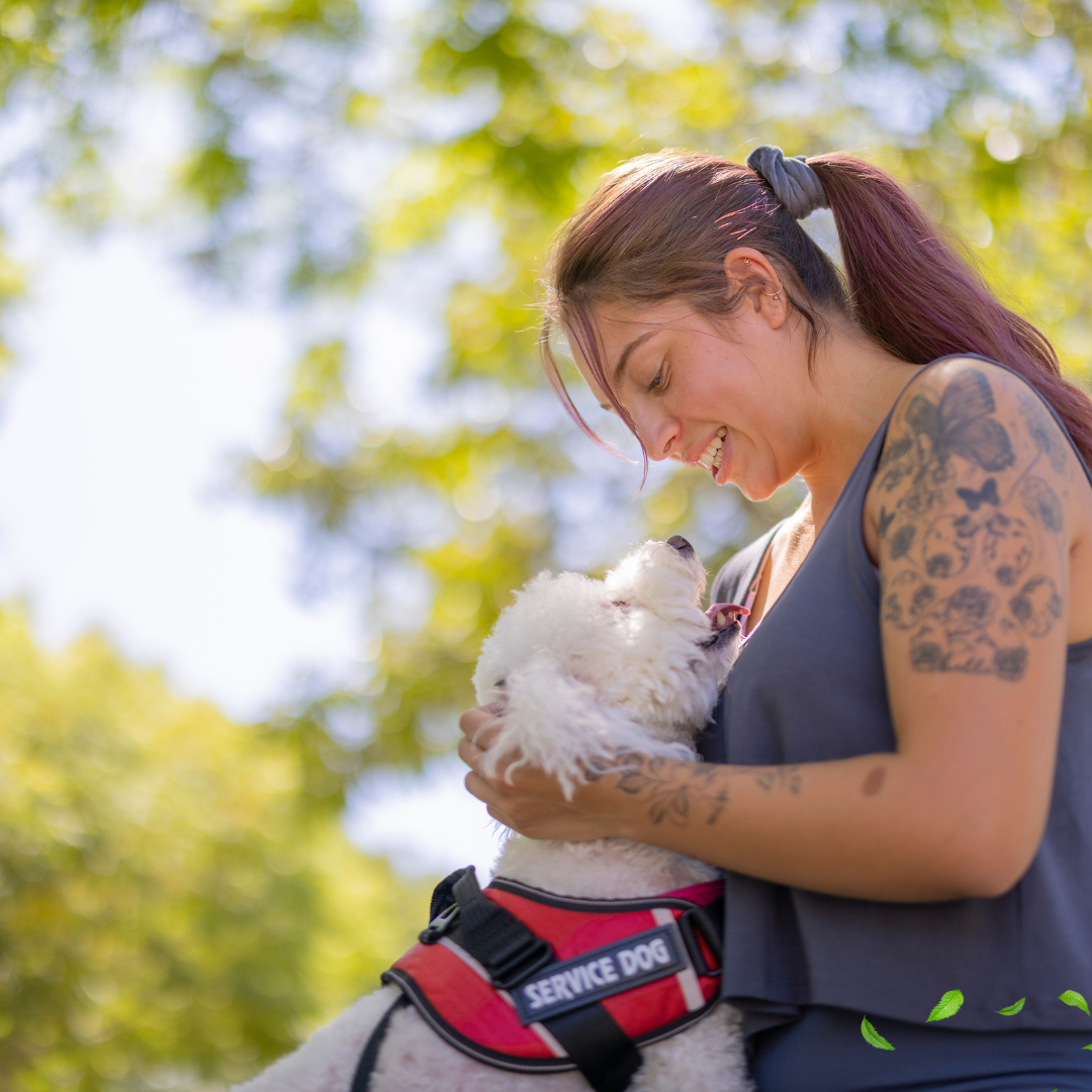 Woman petting happy working service dog now a family member